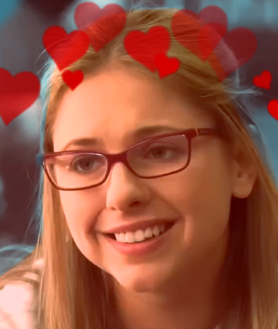 Erica looking at sarah with hearts over hear head and a blue background